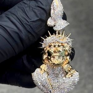 10 kt gold with 2 carat diamond Jesus Pendent with the bail of joining hands.